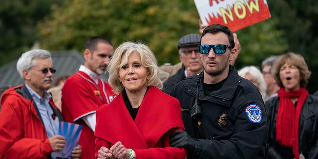 In this October 25, 2019 file photo, actress and activist Jane Fonda locks down a street in Washington, D.C. after she and other demonstrators called on Congress to take action to address climate change. Arrested in the Houses of Parliament.