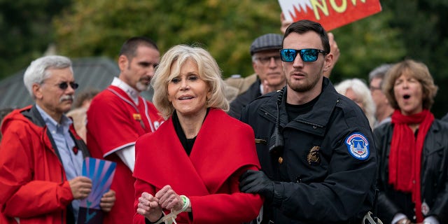 In this October 25, 2019 file photo, actress and activist Jane Fonda locks down a street in Washington, D.C. after she and other demonstrators called on Congress to take action to address climate change. Arrested in the Houses of Parliament.