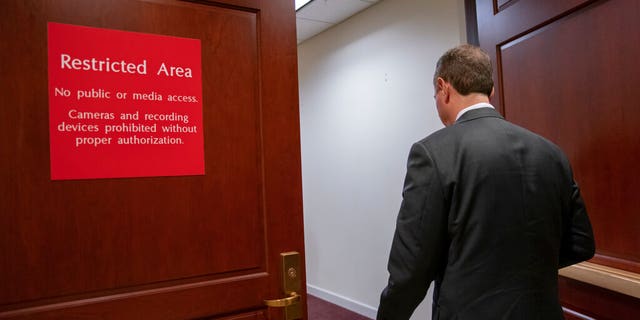 Rep. Adam Schiff, chairman of the House Intelligence Committee, returns to a secure area after speaking to reporters after witnesses defied a subpoena to appear before House impeachment investigators following President Donald Trump's orders not to cooperate with the probe, in Washington, Monday, Nov. 4, 2019. John Eisenberg, the lead lawyer for the National Security Council, and National Security Council aide Michael Ellis, were scheduled to testify early Monday but not appear. (AP Photo/J. Scott Applewhite)