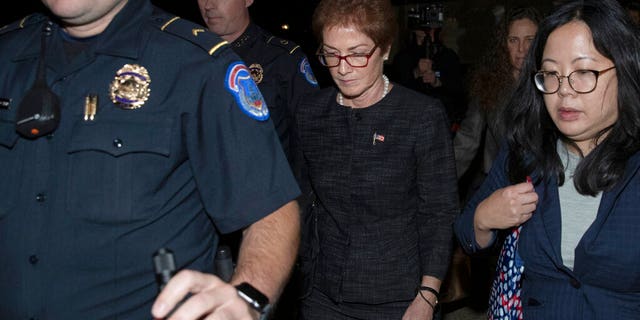 ​​​​​​​Former U.S. Ambassador to Ukraine Marie Yovanovitch, center, leaves Capitol Hill in Washington, after testifying before congressional committee members, Oct. 11, 2019. (Associated Press)