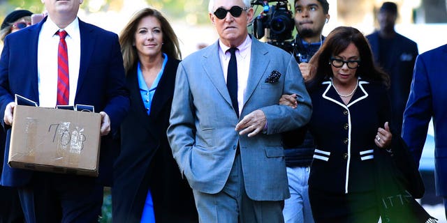 Roger Stone, with his wife, Nydia Stone, right, arrives at Washington D.C. federal court Tuesday. (AP Photo/Manuel Balce Ceneta)