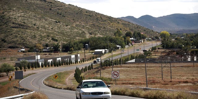 A car passes through Colonia LeBaron, one of many locations where the extended LeBaron family lives in the Galeana municipality of Chihuahua state in northern Mexico, Tuesday, Nov. 5, 2019. Drug cartel gunmen ambushed on Monday three vehicles along a road near the state border of Chihuahua and Sonora, slaughtering at least six children and three women from the extended LeBaron family, all of them U.S. citizens living in northern Mexico, authorities said Tuesday.