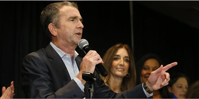 Virginia Gov. Ralph Northam speaks to supporters at a Democratic election party in Richmond, Va., Tuesday, Nov. 5, 2019. (AP Photo/Steve Helber)