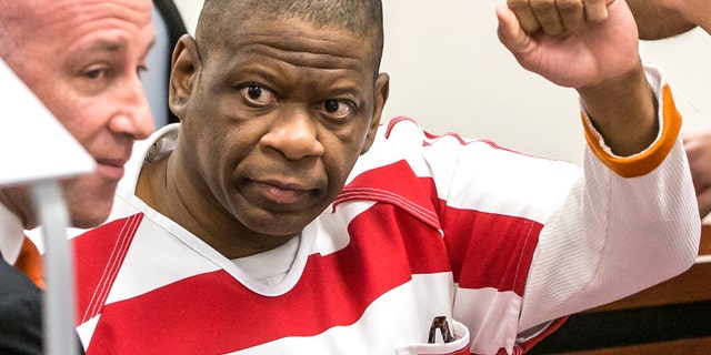 In this Oct. 13, 2017, file photo, death row inmate Rodney Reed waves to his family in the Bastrop County District Court in Bastrop, Texas. Supporters for Reed, who's facing lethal injection in less than two weeks for a murder he says he didn't commit, are mounting a final push in the courts and on social media to stop his execution, which is being called into question by lawmakers, pastors, celebrities and the European Union.