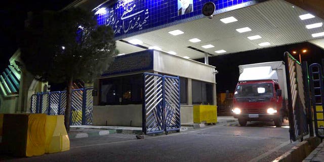 A truck containing a cylinder of uranium hexafluoride gas leaves the Ahmadi Roshan uranium enrichment facility in Natanz to travel to the Fordo nuclear facility. 