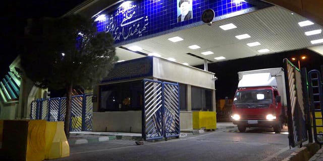 A truck containing a cylinder of uranium hexafluoride gas leaves the Ahmadi Roshan uranium enrichment facility in Natanz to travel to the Fordo nuclear facility.