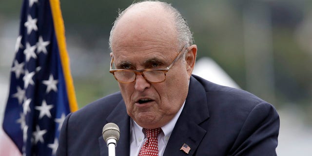 FILE - In this Aug. 1, 2018, file photo,Rudy Giuliani, personal attorney for President Donald Trump, speaks in Portsmouth, N.H. Giuliani, says he’s being represented by three lawyers as federal prosecutors in New York look into his business dealings. (AP Photo/Charles Krupa, File)