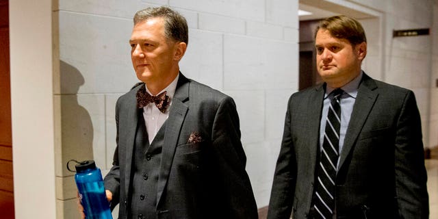 FILE - In this Oct. 15, 2019, file photo, Deputy Assistant Secretary of State George Kent arrives on Capitol Hill in Washington. House impeachment investigators released a transcript from Kent, a career official at the State Department on Nov. 7. He testified that he was told to 