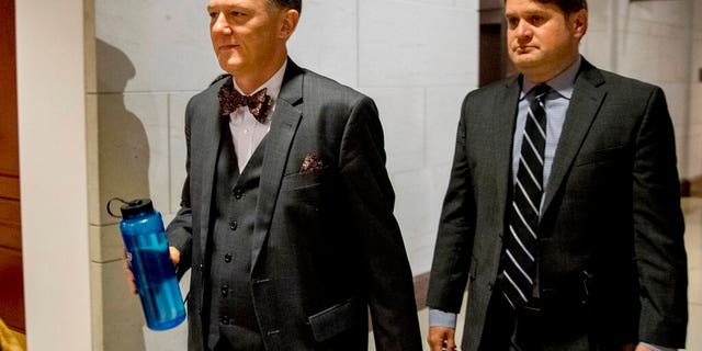 FILE - In this Oct. 15, 2019, file photo, Deputy Assistant Secretary of State George Kent arrives on Capitol Hill in Washington. House impeachment investigators released a transcript from Kent, a career official at the State Department on Nov. 7. He testified that he was told to