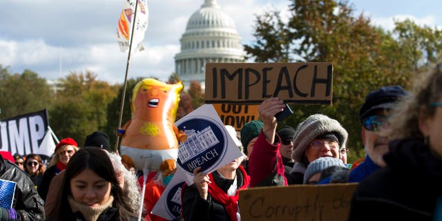 Demonstrators marching on Pennsylvania Avenue protesting against climate policies and President Trump, in Washington last week. (AP Photo/Jose Luis Magana)