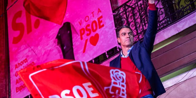 Spain's Prime Minister and Socialist Party leader Pedro Sanchez gestures to supporters outside the party headquarters following the general election in Madrid.