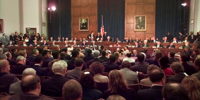 In this Nov. 19, 1998 file photo, House Judiciary Committee Chairman Henry Hyde, R-Ill., presided over the committee's impeachment hearing for President Clinton. (AP Photo/Joe Marquette, File)