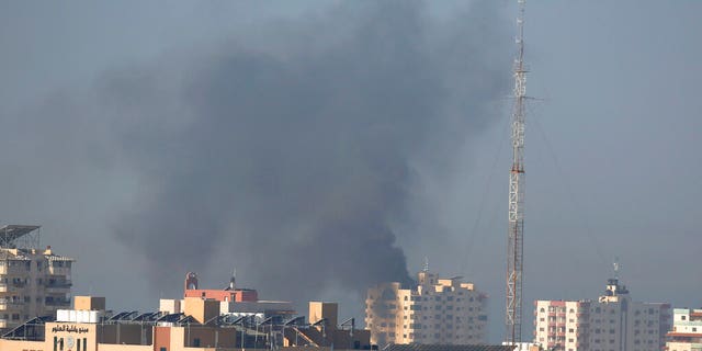 Nov. 12: Smoke rises after an Israeli forces strike in Gaza City. Israel killed a senior Islamic Jihad commander in Gaza early Tuesday in a resumption of pinpointed targeting that threatens a fierce round of cross-border violence with Palestinian militants. (AP Photo/Hatem Moussa)