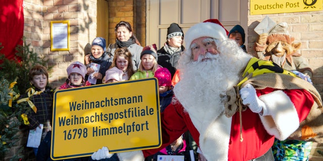 As part of the annual event organized by Germany’s Deutsche Post, Santa and 20 helpers last year responded to 277,200 letters from 64 countries. (Soeren Stache/dpa via AP)