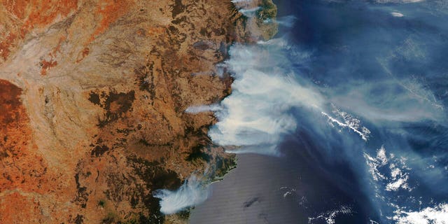 This NASA Modis satellite image provided by Maxar shows smoke from wildfires burning in New South Wales, Australia, Thursday, Nov. 14, 2019.