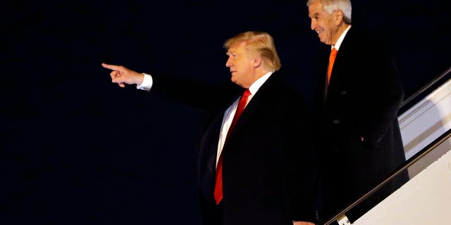 President Donald Trump arriving at Barksdale Air Force Base, La., with Republican gubernatorial candidate Eddie Rispone. (AP Photo/ Evan Vucci)