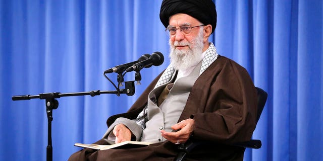 In this picture released by an official website of the office of the Iranian supreme leader, Supreme Leader Ayatollah Ali Khamenei talks to clerics in his Islamic thoughts class in Tehran, Iran, Sunday, Nov. 17, 2019. Iran's supreme leader on Sunday backed the government's decision to raise gasoline prices and called angry protesters who have been setting fire to public property over the hike "thugs," signaling a potential crackdown on the demonstrations.