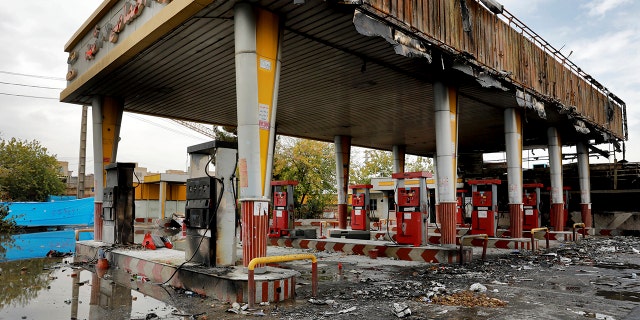 A gas station shows damages after it was attacked and burned during protests over rises in government-set gasoline prices, in Tehran, Iran, Wednesday, Nov. 20, 2019. Demonstrations struck at least 100 cities and towns, spiraling into violence that saw banks, stores and police stations attacked and burned.