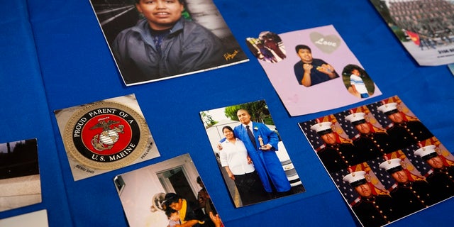 Photos of Jilmar Ramos-Gomez posted on a table at a press conference held by the American Civil Liberties Union of Michigan and Loevy & amp; Loevy Civil Law Attorneys. (Brian Hayes / The Grand Rapids Press via AP)