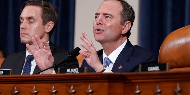 House Intelligence Committee Chairman Adam Schiff, D-Calif., with committee staffer Daniel Noble at left, makes impassioned remarks at the conclusion of a week of public impeachment hearings on President Donald Trump's efforts to tie U.S. aid for Ukraine to investigations of his political opponents, on Capitol Hill in Washington, Thursday, Nov. 21, 2019. Schiff sent out a fundraising email following Rep. Liz Cheney's ouster from House leadership on May 12, 2021. (AP Photo/J. Scott Applewhite)