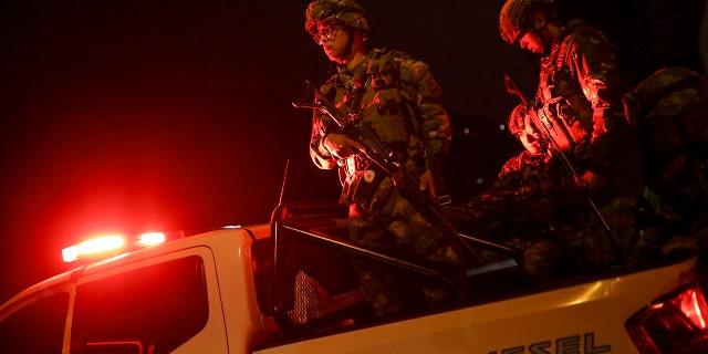 Soldiers leave from a military base to patrol the streets in Bogota, Colombia, Saturday, Nov. 23, 2019. Authorities in Colombia are maintaining a heightened police and military presence in the nation's capital following two days of unrest. (AP Photo/Ivan Valencia)