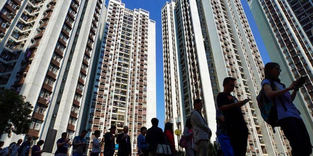 People line up to vote outside a polling place in Hong Kong. (AP Photo/Vincent Yu)