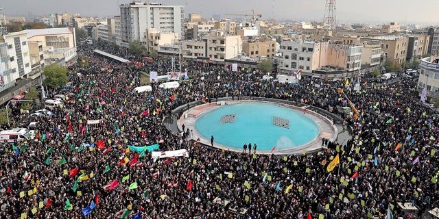 Demonstrators attend a pro-government rally organized by authorities in Iran denouncing last week’s violent protests over a fuel price hike, in Tehran on Monday. (AP Photo/Ebrahim Noroozi)