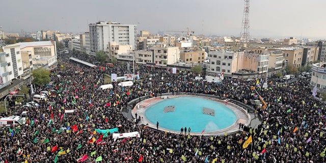 Demonstrators attend a pro-government rally organized by authorities in Iran denouncing last week’s violent protests over a fuel price hike, in Tehran on Monday. (AP Photo/Ebrahim Noroozi)