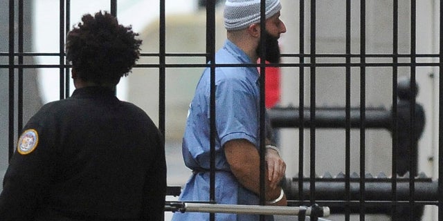 US News Adnan Syed enters a Baltimore courthouse prior to a 2016 hearing in his case. (Barbara Haddock Taylor/The Baltimore Sun via AP)