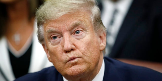 President Trump participates in a bill signing ceremony for the Preventing Animal Cruelty and Torture Act in the Oval Office of the White House on Monday in Washington. (AP Photo/Patrick Semansky)