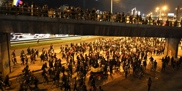 Anti-government demonstrators march in Bogota, Colombia, Monday, Nov. 25, 2019. Protests against the government of President Ivan Duque continued for the fifth consecutive day as students, women's groups and indigenous people marched through the center of the nation's capital. (AP Photo/Fernando Vergara)