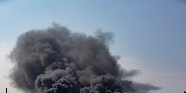 Smoke rises from an explosion at the TPC Group Port Neches Operations plant on Wednesday in Port Neches, Texas. (Marie D. De Jesus/Houston Chronicle via AP)