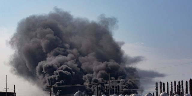 Smoke rises from an explosion at the TPC Group Port Neches Operations plant on Wednesday in Port Neches, Texas. (Marie D. De Jesus/Houston Chronicle via AP)