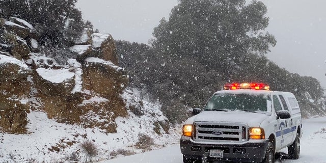  This image tweeted by the Santa Barbara County Fire Department shows a Santa Barbara Fire Department truck along E. Camino Cielo as snow falls at the 3,500 foot level on the fire footprint in Santa Barbara, Calif. Thursday&, Nov. 28, 2019. Wintry weather condition temporarily loosened its grip across much of the U.S. in the nick of time for Thanksgiving, after tangling holiday tourists in ice, snow and wind and prior to more significant storms come down Friday.( Mike Eliason/Santa Barbara County Fire through AP)