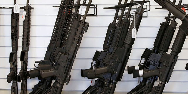 Salesman Ryan Martinez clears the chamber of an AR-15 at the "Ready Gunner" gun store In Provo, Utah, U.S. in Provo, Utah, U.S., June 21, 2016. REUTERS/George Frey