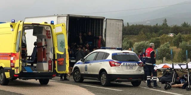 Migrants are seen inside a refrigerated truck found by police, after a check at a motorway near Xanthi, Greece, November 4, 2019.