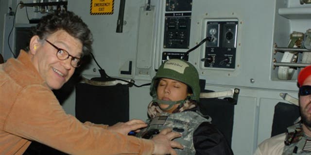Al Franken is seen in a controversial photo that led to his resignation from the U.S. Senate in 2018.