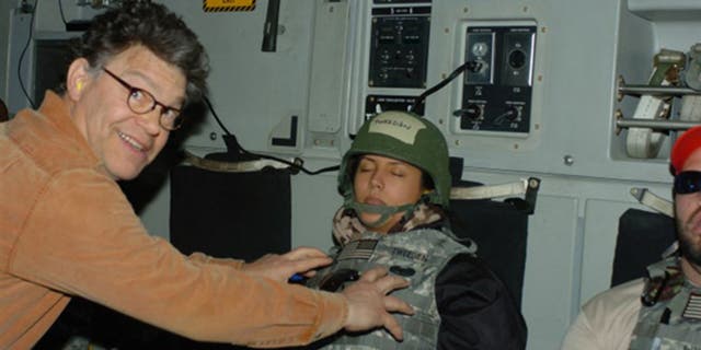 Al Franken is seen in a controversial photo that led to his resignation from the U.S. Senate in 2018.