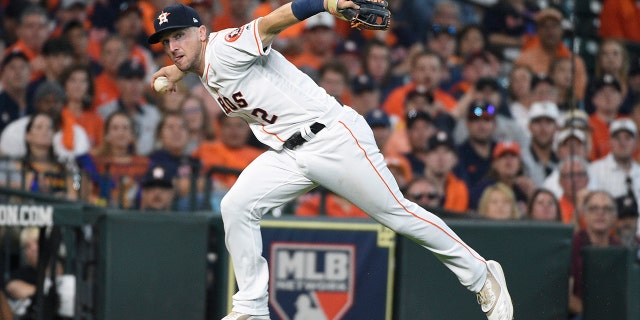 FILE - In this Oct. 4, 2019, file photo, Houston Astros third baseman Alex Bregman looks to first after fielding a grounder by Tampa Bay Rays' Tommy Pham, who was safe at first in the seventh inning during Game 1 of a baseball American League Division Series in Houston. If Bregman is the American League’s Most Valuable Player when the voting is announced Thursday, Nov. 14, the Astros will become the first team to have an MVP, Cy Young Award winner and Rookie of the Year in the same season. Justin Verlander took Cy Young honors, and Yordan Alvarez was picked as the AL’s top rookie. AP Photo/Eric Christian Smith, File)