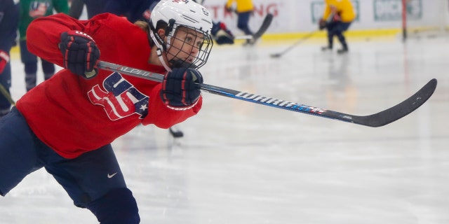 In this Monday, Nov. 4, 2019, photo, Alexandra Carpenter goes through drills while playing with the U.S. Women's National hockey team in Cranberry Township, Butler County, Pa., ahead of scheduled exhibition games against Canada. Carpenter, college hockey's top player in 2015 and daughter of former NHL star Bobby Carpenter, is also leading Russia's Women's Hockey League in scoring while playing for the Chinese-based Shenzhen KRS Vanke Rays. (AP Photo/Keith Srakocic)