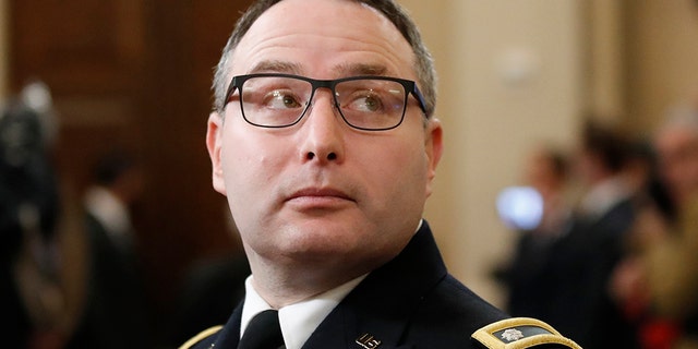 Then-National Security Council aide Lt. Col. Alexander Vindman arrives to testify before the House Intelligence Committee on Capitol Hill in Washington, Tuesday, Nov. 19, 2019, during a public impeachment hearing of President Donald Trump's efforts to tie U.S. aid for Ukraine to investigations of his political opponents. (AP Photo/Alex Brandon)