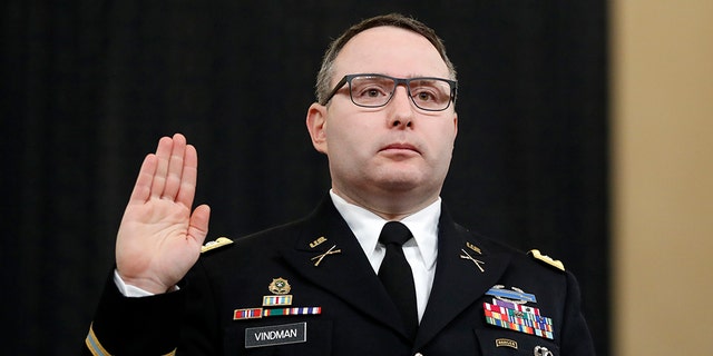 National Security Council aide Lt. Col. Alexander Vindman is sworn in to testify before the House Intelligence Committee on Capitol Hill in Washington, Tuesday, Nov. 19, 2019, during a public impeachment hearing of President Donald Trump's efforts to tie U.S. aid for Ukraine to investigations of his political opponents. (AP Photo/Andrew Harnik)