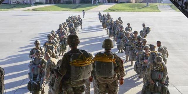 Paratroopers assigned to the 3rd Brigade Combat Team, 82nd Airborne Division load an Airforce C-17 Globemaster aircraft to conduct Operation Panther Storm in March at Fort Bragg. An Army veteran allegedly re-enlisted under false name years ago and applied for passports using the name, authorities said. 