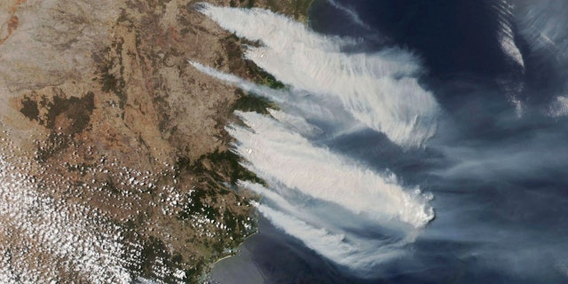This Nov. 8, 2019, satellite photo taken by NASA shows hot, dry and windy weather conditions as bushfires burn in the eastern part of News South Wales state.