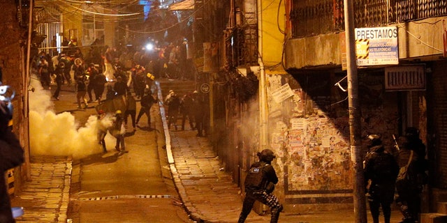 Police launch tear gas to disperse demonstrators during a protest against President Evo Morales' reelection, in La Paz, Bolivia, Tuesday, Nov. 5, 2019.