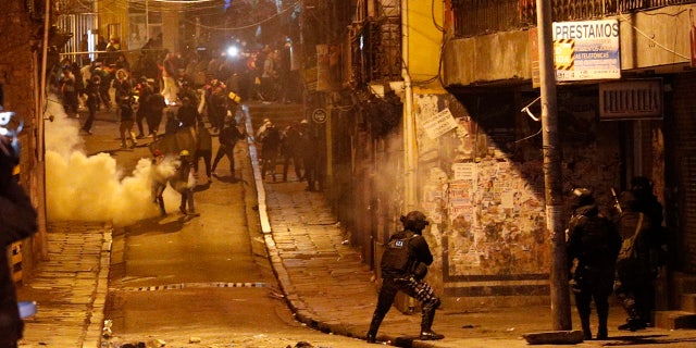 Police launch tear gas to disperse demonstrators during a protest against President Evo Morales' reelection, in La Paz, Bolivia, Tuesday, Nov. 5, 2019.