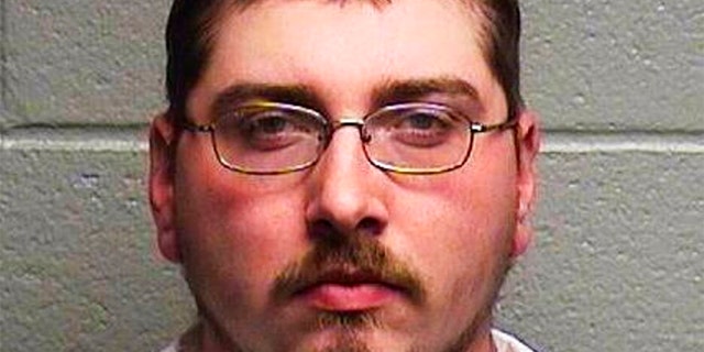 Brandon Ayscue, police say, is charged with assault with a deadly weapon after an argument over towing a vehicle early Friday in Durham, N.C. (AP/Durham Police Department)