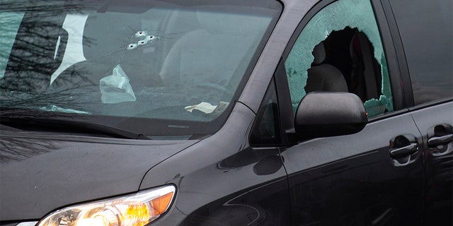 Bullet holes are seen here in the windows of a van in the parking lot of Sarah J. Anderson Elementary School in Vancouver, Wash., following a shooting on Tuesday, Nov. 26, 2019. Authorities say a man shot several people in a Vancouver, Wash., elementary school parking lot and then shot himself after a police chase.