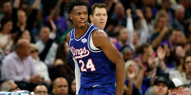 Sacramento Kings guard Buddy Hield runs down court after scoring a 3-point shoot in the closing minutes of the Kings 100-99 win over the Boston Celtics in an NBA basketball game in Sacramento, Calif., Sunday, Nov. 17, 2019. (AP Photo/Rich Pedroncelli)