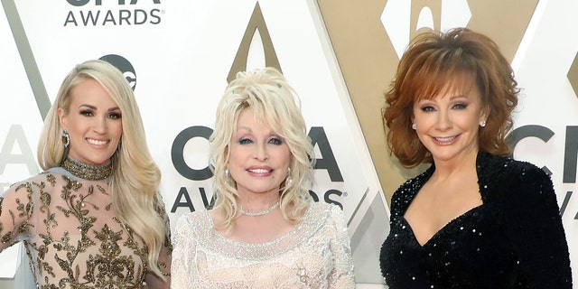 Reba McEntire attends the 53rd annual CMA Awards in 2019 alongside Carrie Underwood and Dolly Parton. In 2020, the singer revealed she is dating actor Rex Linn.